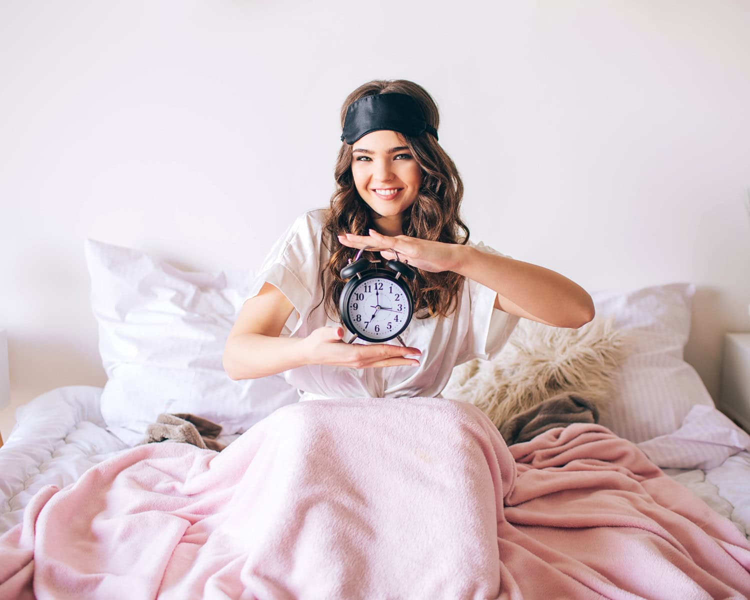 woman waking up well rested after treating her sleep apnea