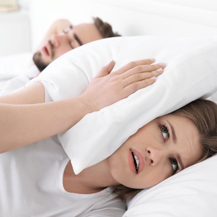 woman kept awake by her husband's snoring