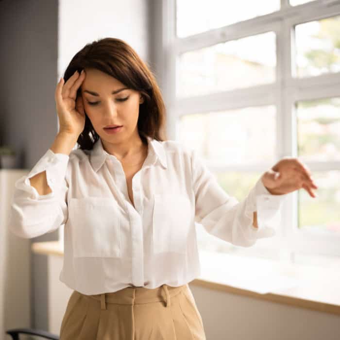 woman experiencing vertigo due to tmj