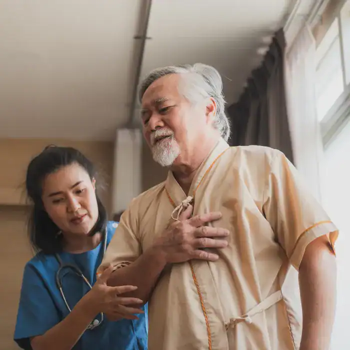 man clutching chest from a heart attack 